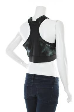 Γυνικείο αθλητικό αμάνικο Reebok2